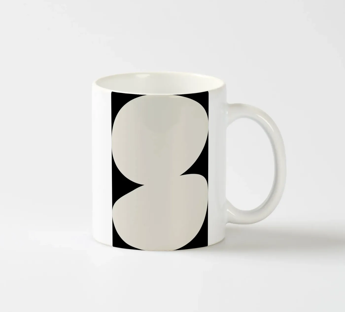 Enveloping ceramic mug by Graphite
