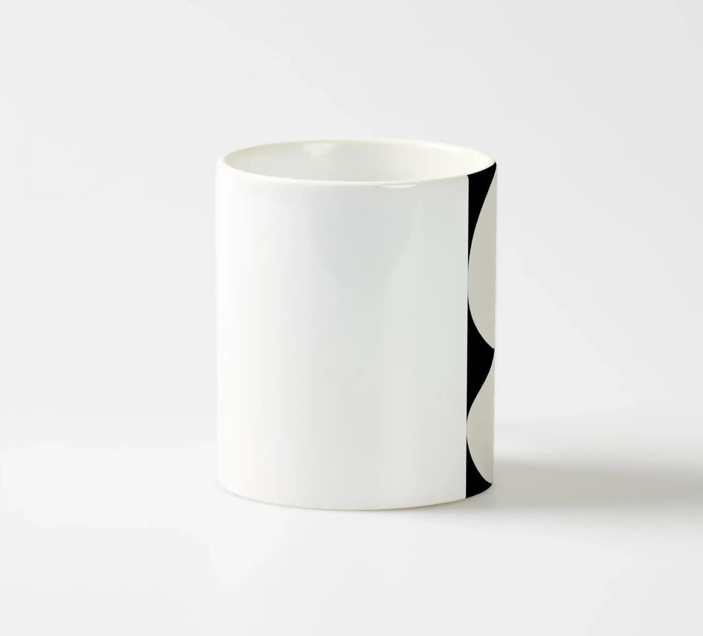 Enveloping ceramic mug by Graphite