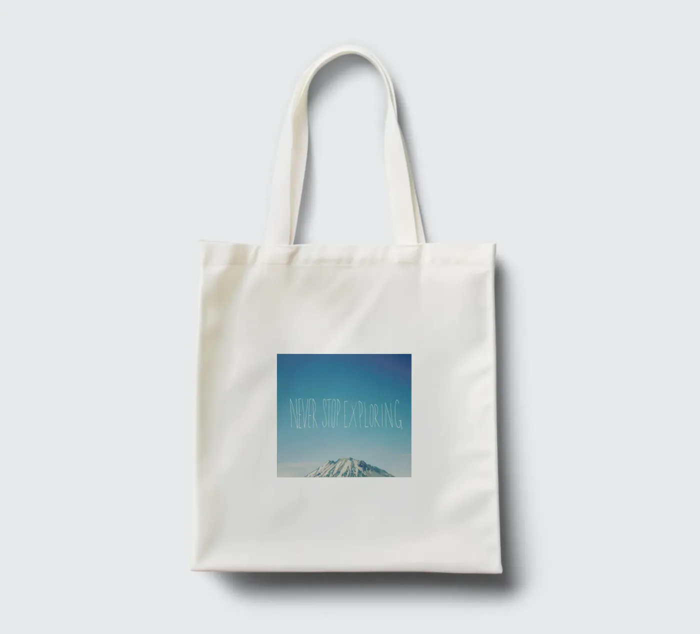 Never Stop Exploring tote bag by Leah Flores