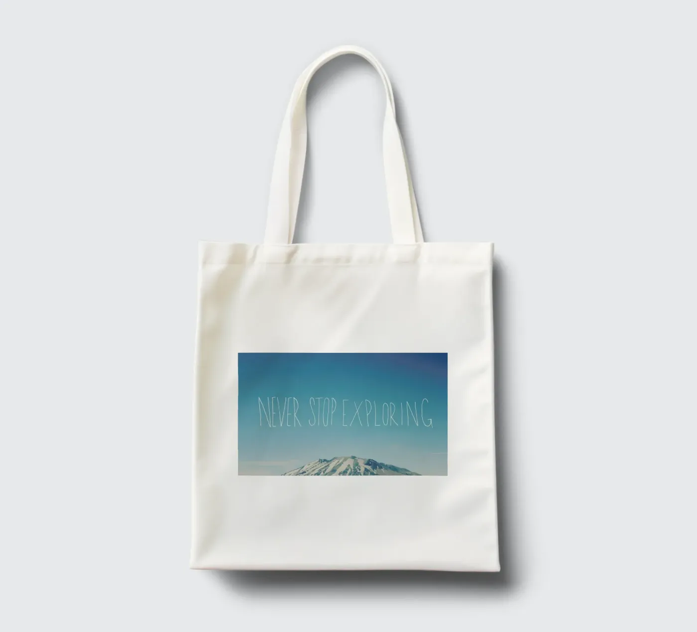 Never Stop Exploring tote bag by Leah Flores