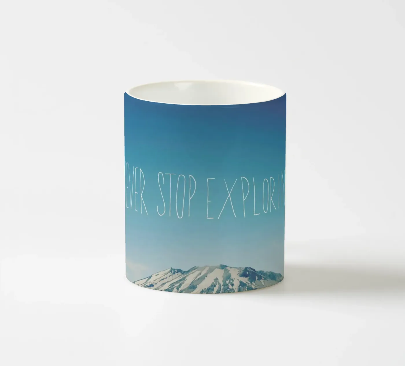 Never Stop Exploring ceramic mug by Leah Flores