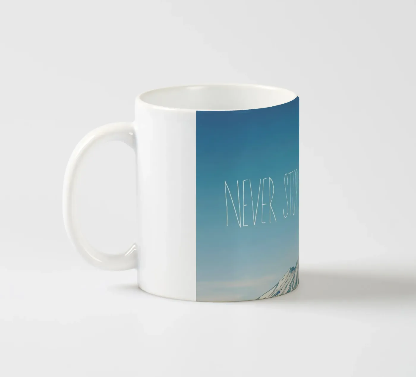 Never Stop Exploring ceramic mug by Leah Flores