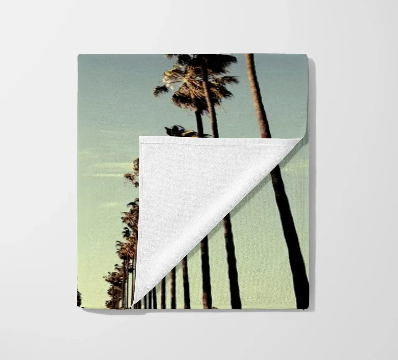 On Sunset beach towel by METROPOLIS