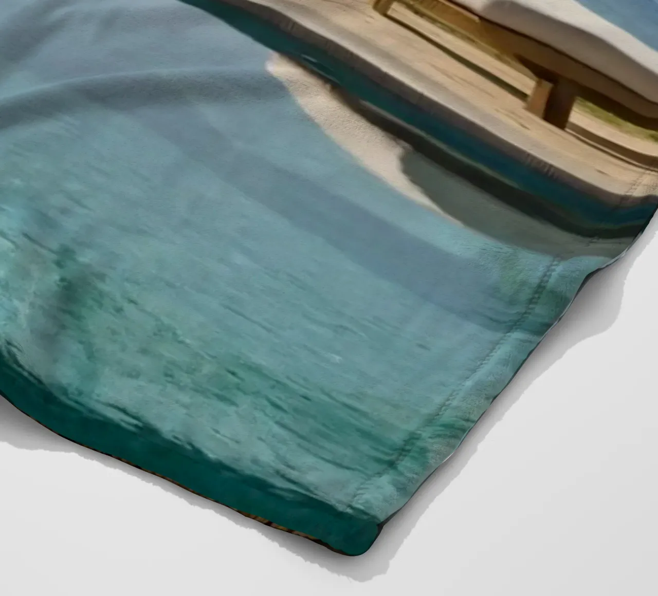 Relaxing by the tranquil poolside with ocean view fleece blanket by DesignDoodle