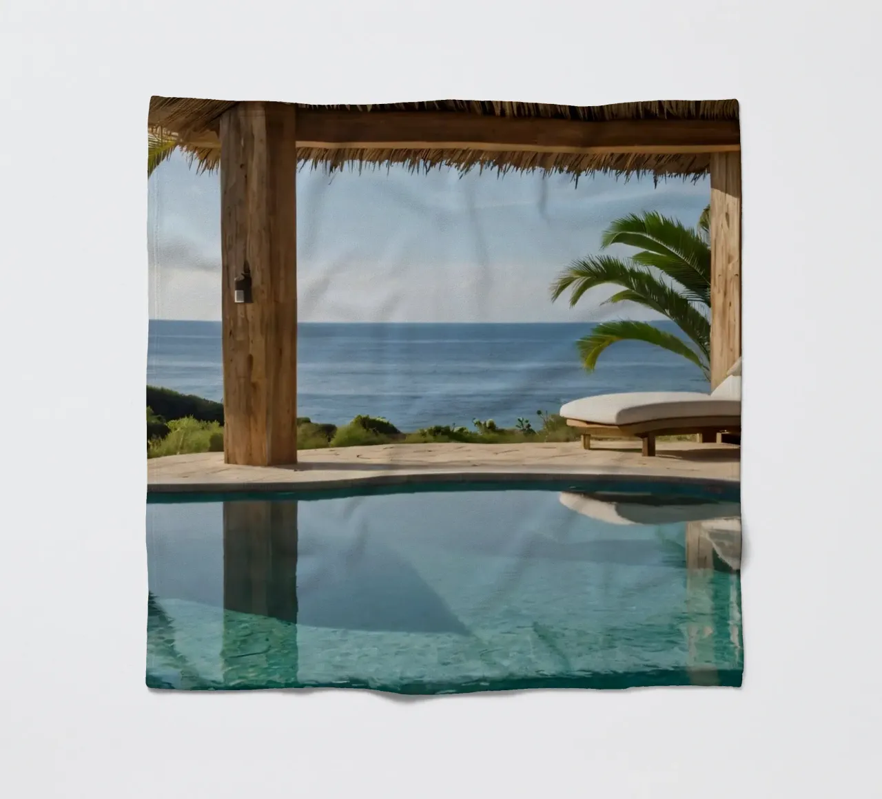 Relaxing by the tranquil poolside with ocean view fleece blanket by DesignDoodle