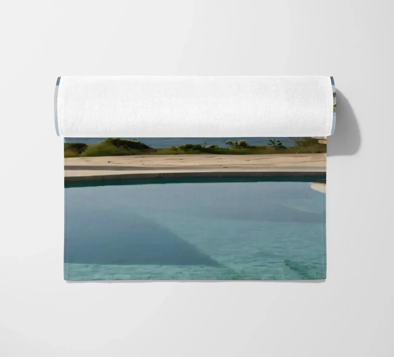 Relaxing by the tranquil poolside with ocean view beach towel by DesignDoodle