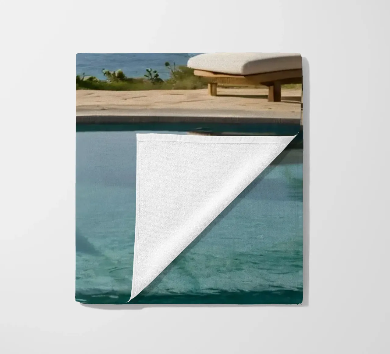 Relaxing by the tranquil poolside with ocean view beach towel by DesignDoodle