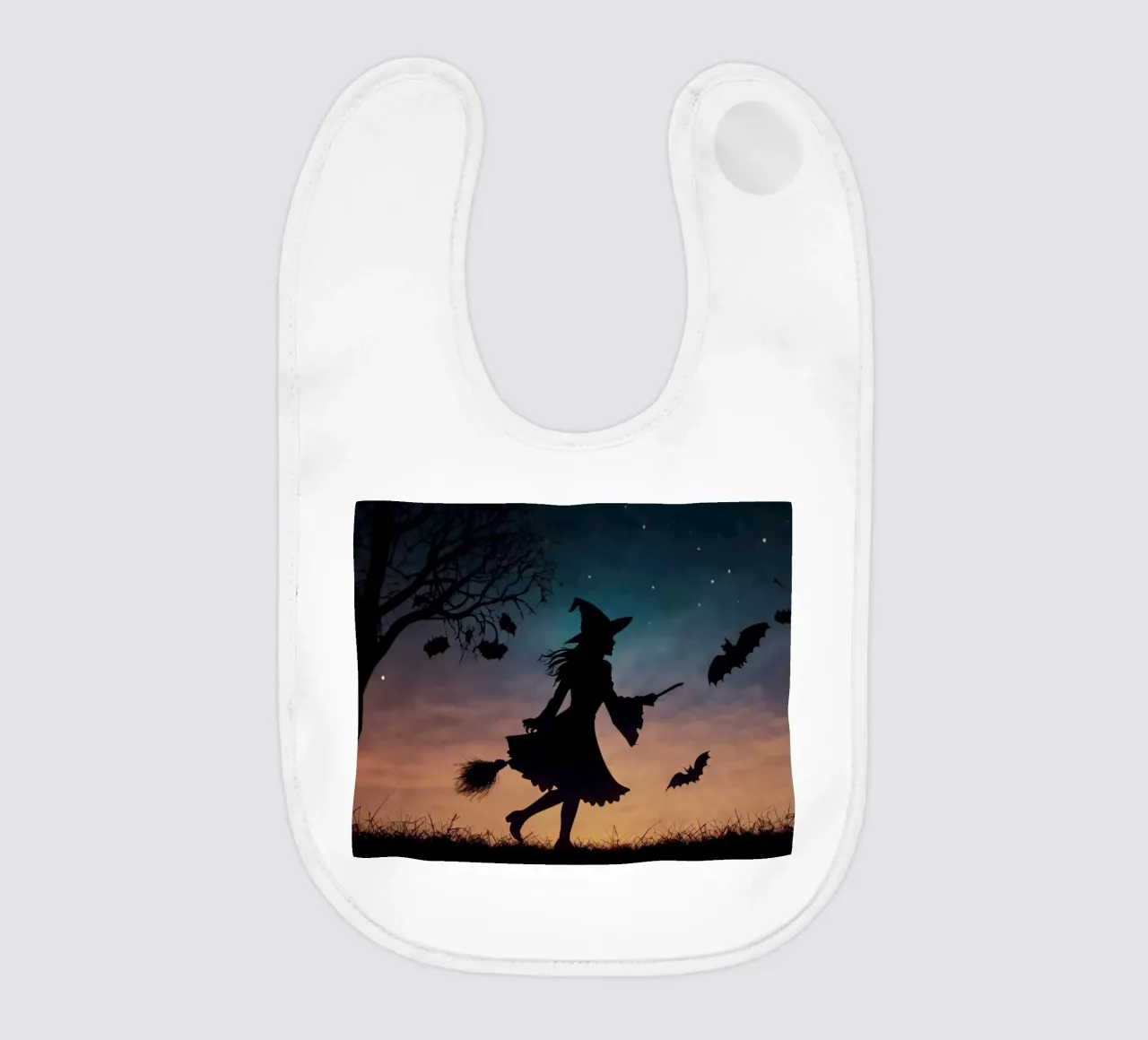A silhouetted witch flying on a broomstick in a twilight bat baby bib by DesignDoodle