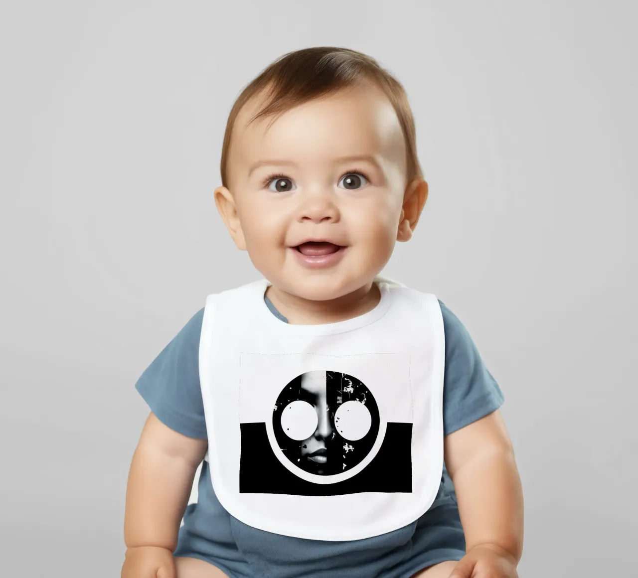 monochrome artwork featuring a face with contrasting black baby bib by DesignDoodle