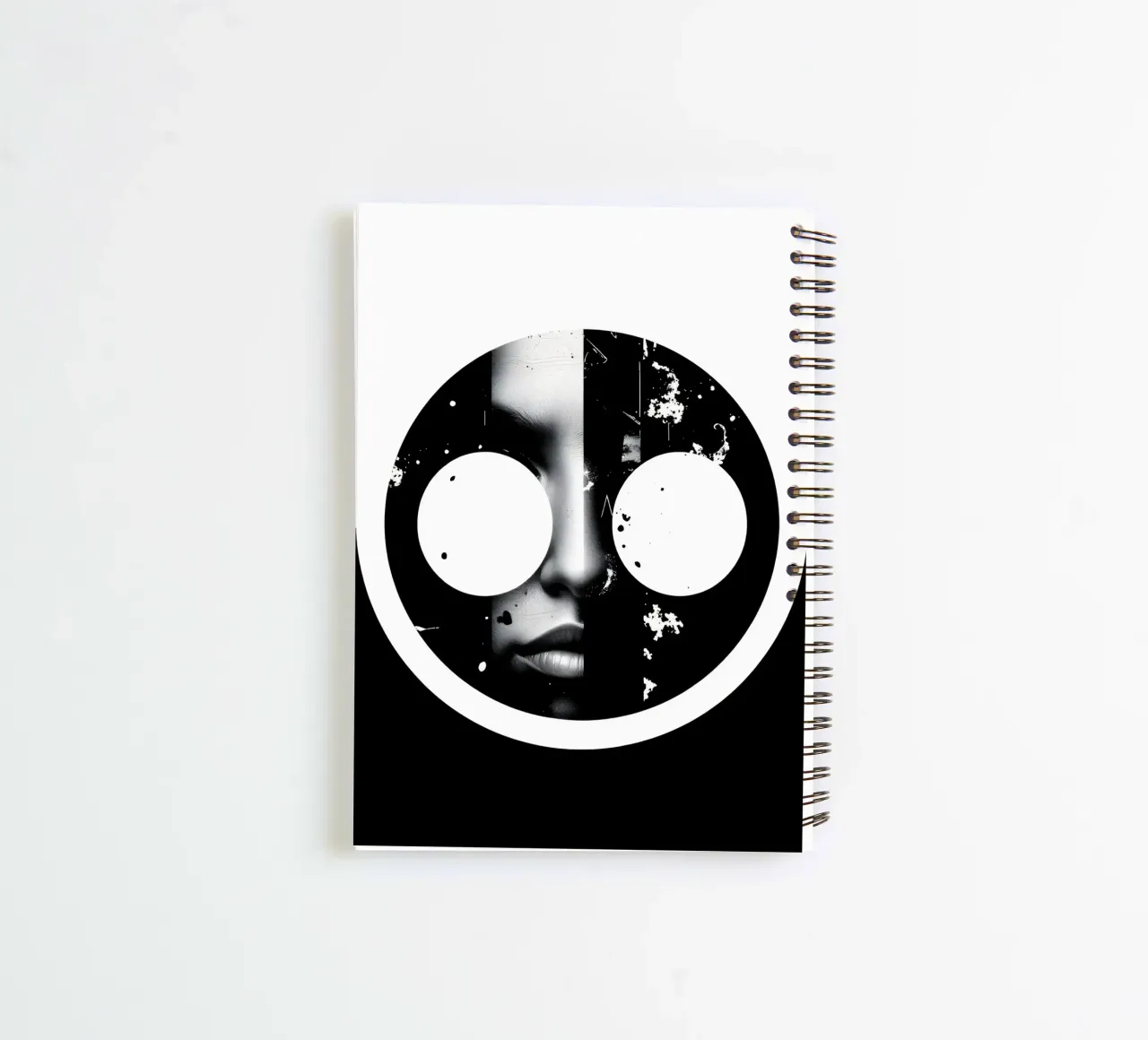monochrome artwork featuring a face with contrasting black spiral notebook by DesignDoodle