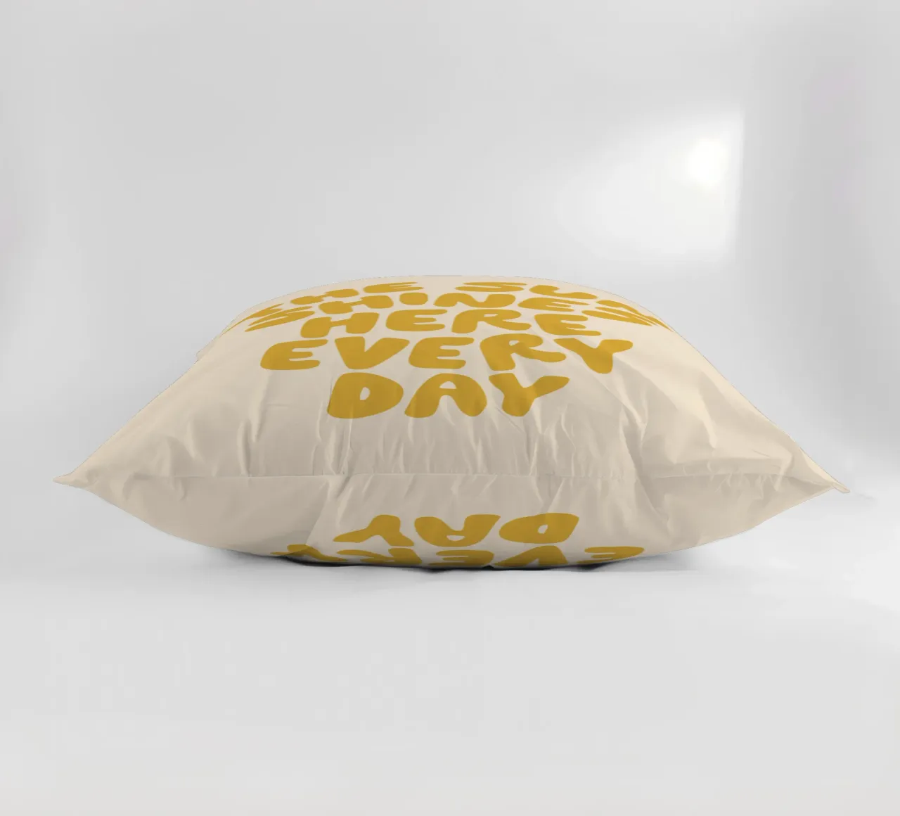 The Sun Shines Here Every Day Typography Print in Yellow decorative cushion by THE MOTIVATED TYPE