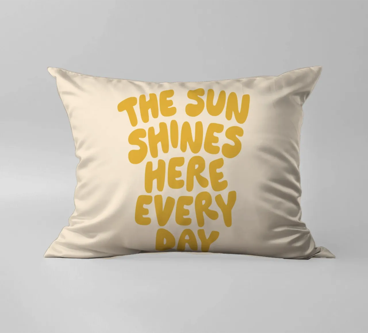 The Sun Shines Here Every Day Typography Print in Yellow decorative cushion by THE MOTIVATED TYPE