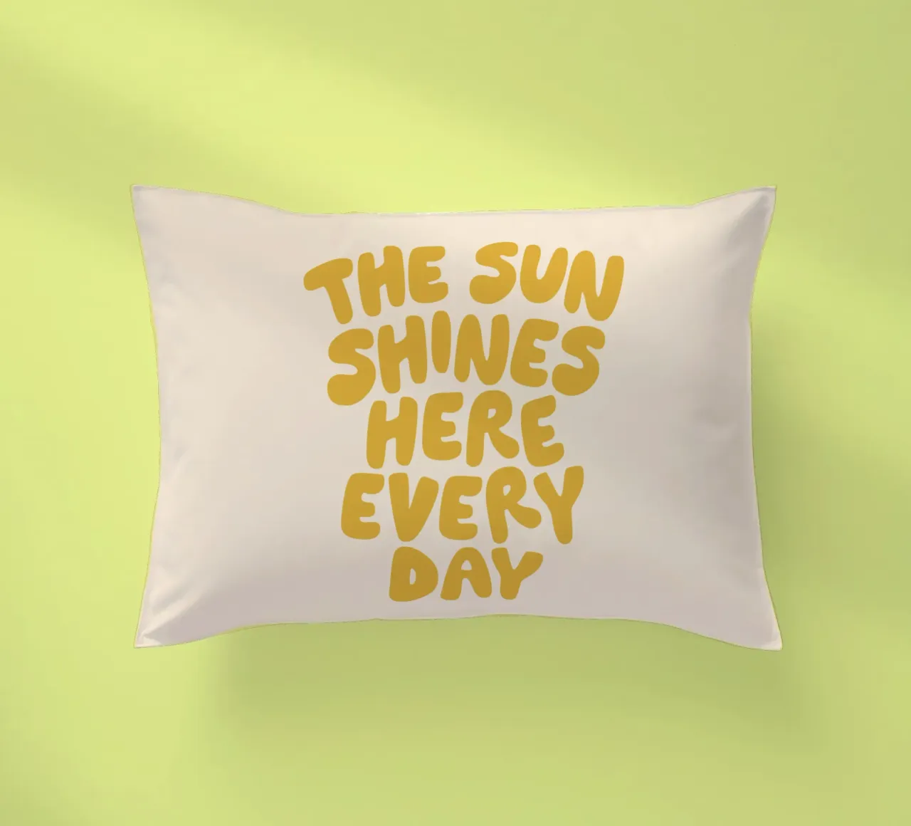 The Sun Shines Here Every Day Typography Print in Yellow decorative cushion by THE MOTIVATED TYPE