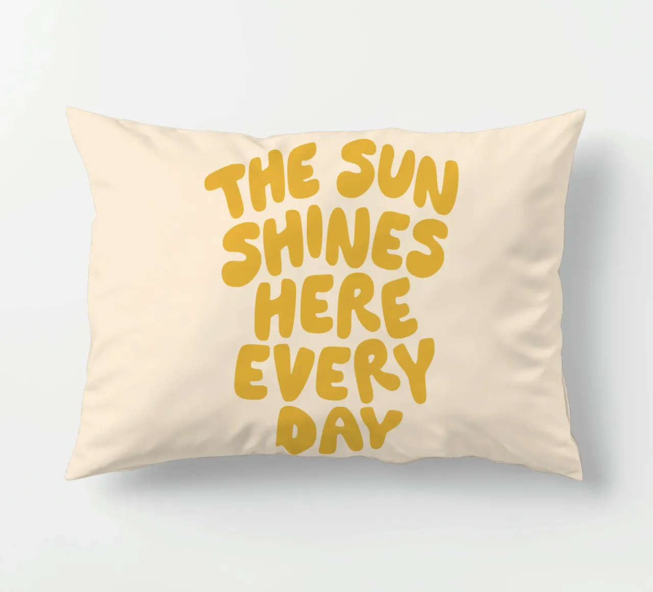 The Sun Shines Here Every Day Typography Print in Yellow decorative cushion by THE MOTIVATED TYPE