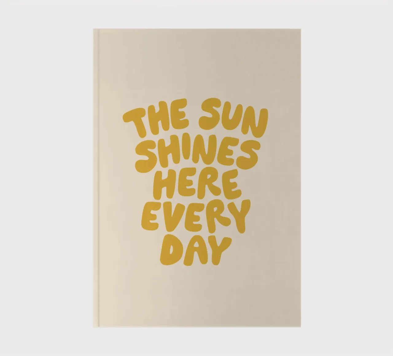 The Sun Shines Here Every Day Typography Print in Yellow notebook by THE MOTIVATED TYPE