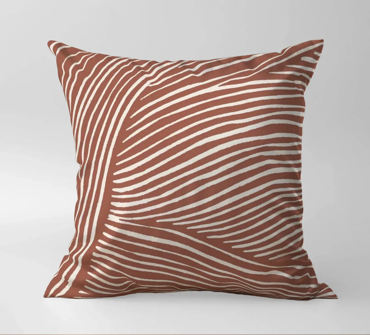 Terracotta linoleumsneden kussen van NouveauPrints