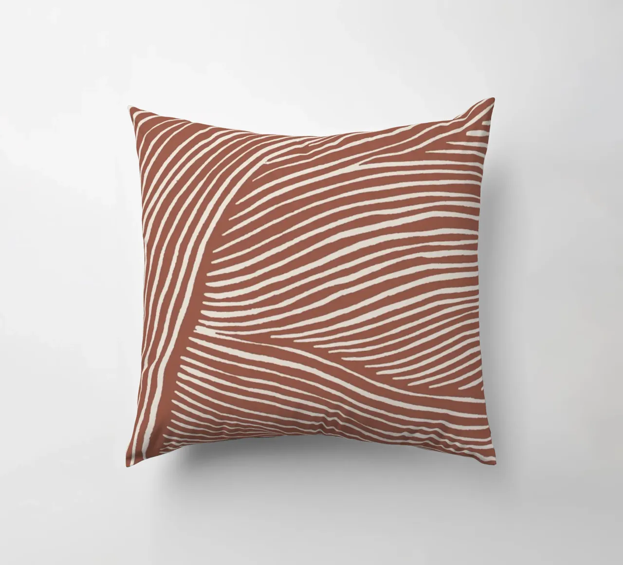 Terracotta linoleumsneden kussen van NouveauPrints