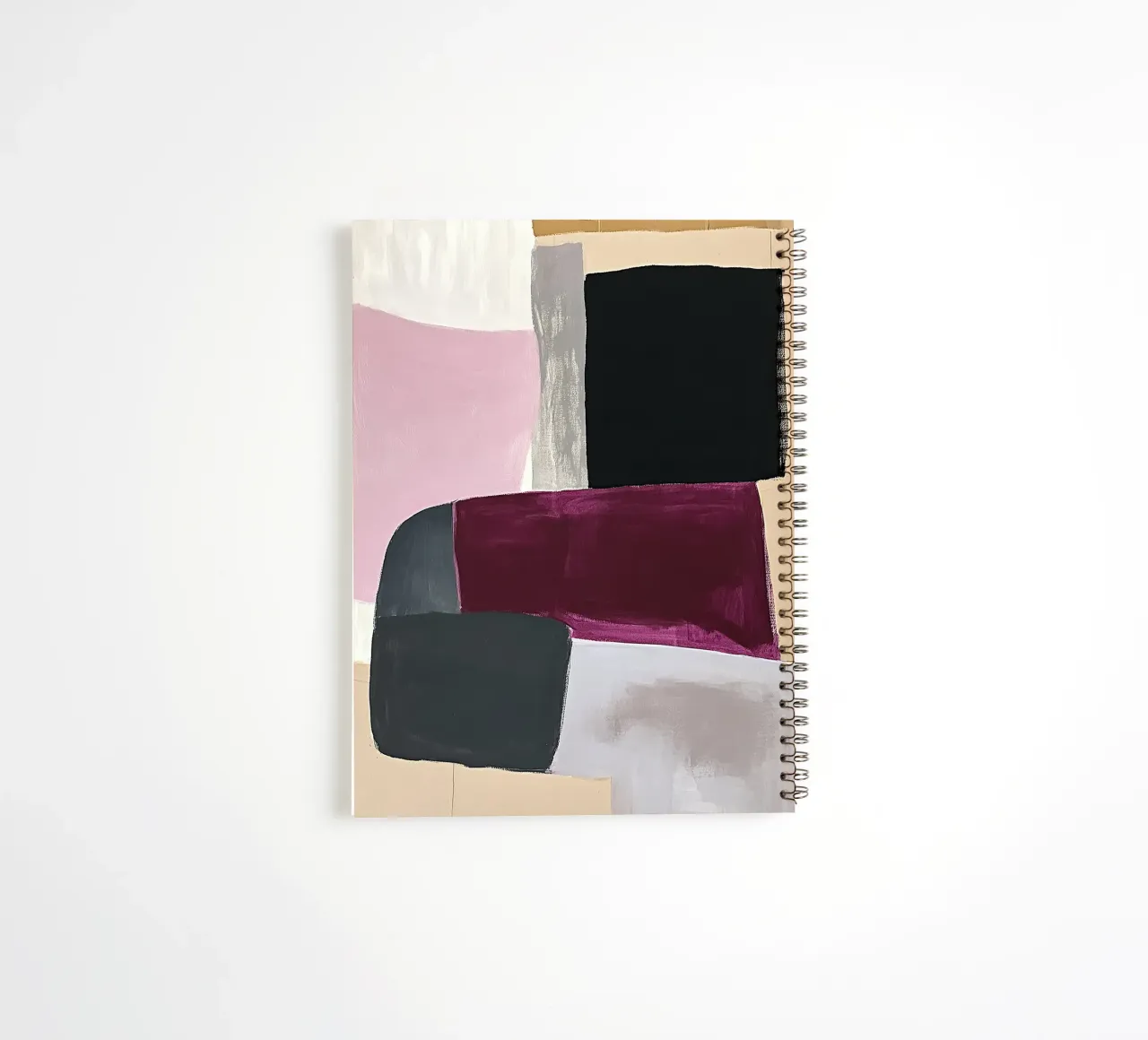 Spaces in pink and burgundy spiral notebook by Euphoria Theresa