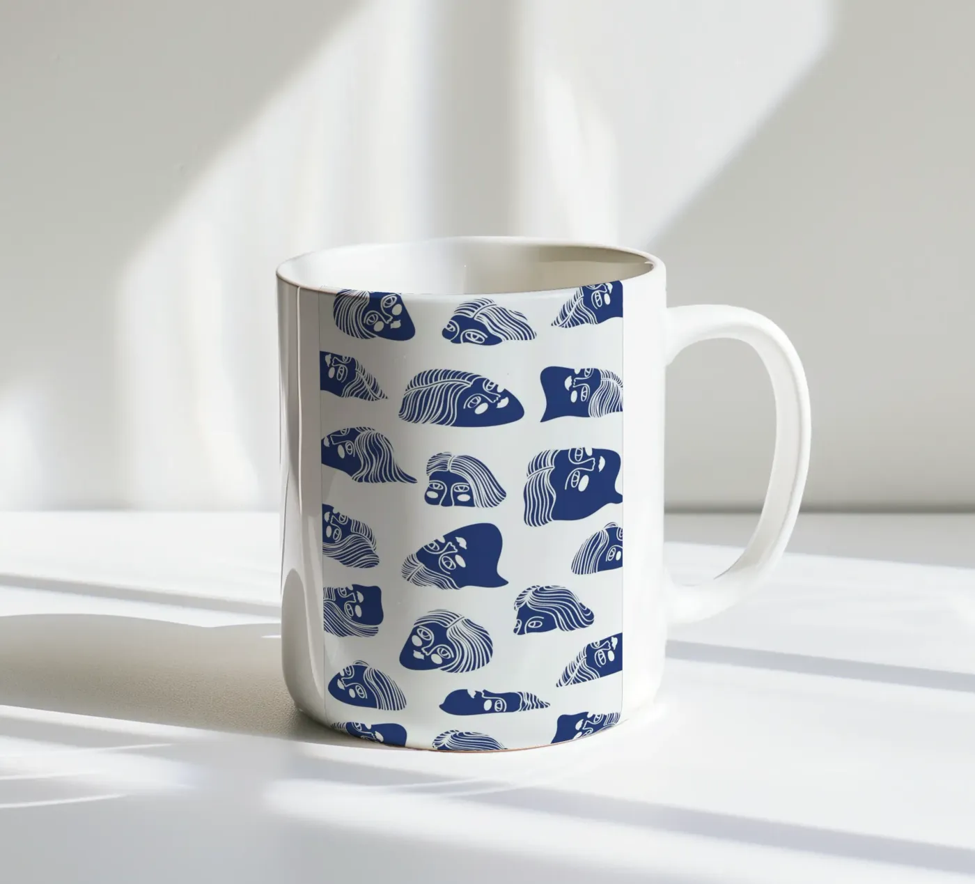 Faces ceramic mug by Pure