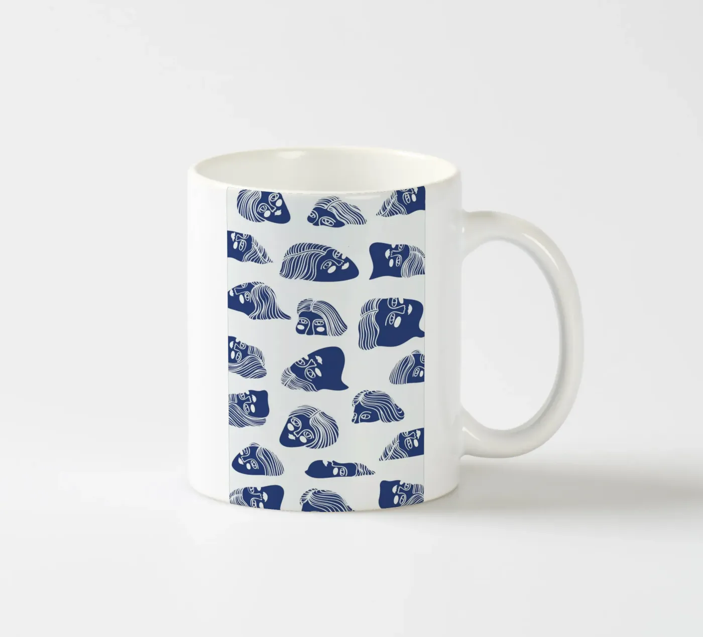 Faces ceramic mug by Pure
