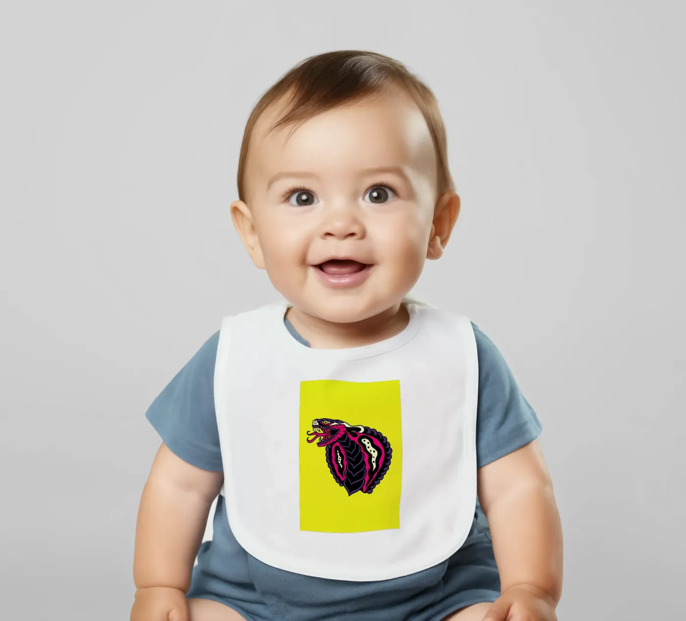 Cobra baby bib by Nick Cocozza