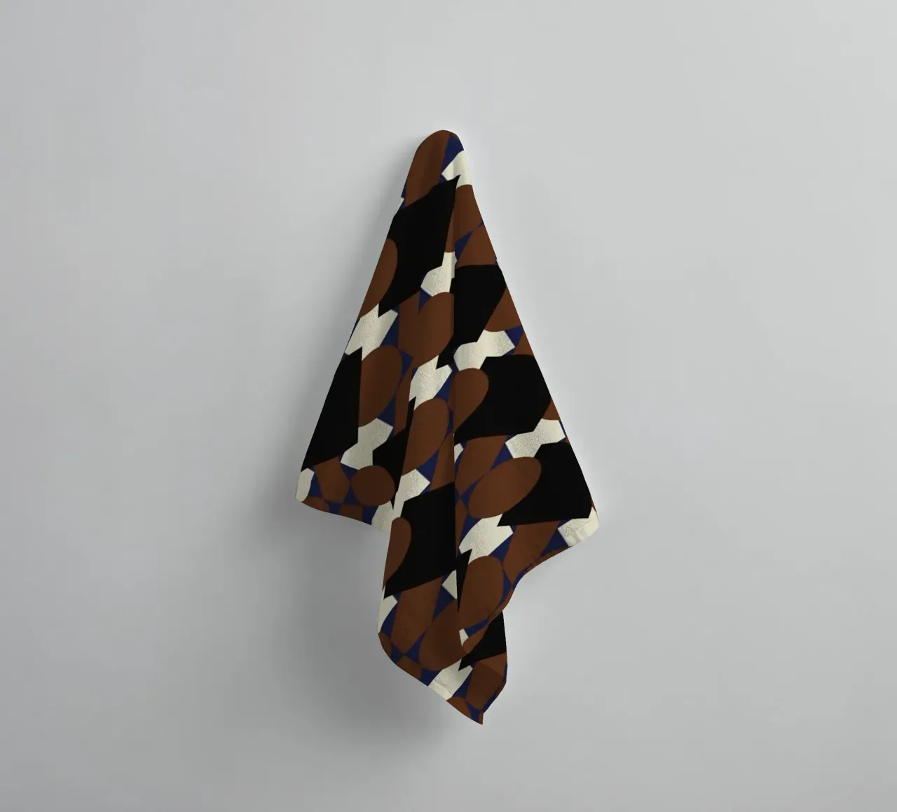 Geometrical pattern brown towel by Little Dean