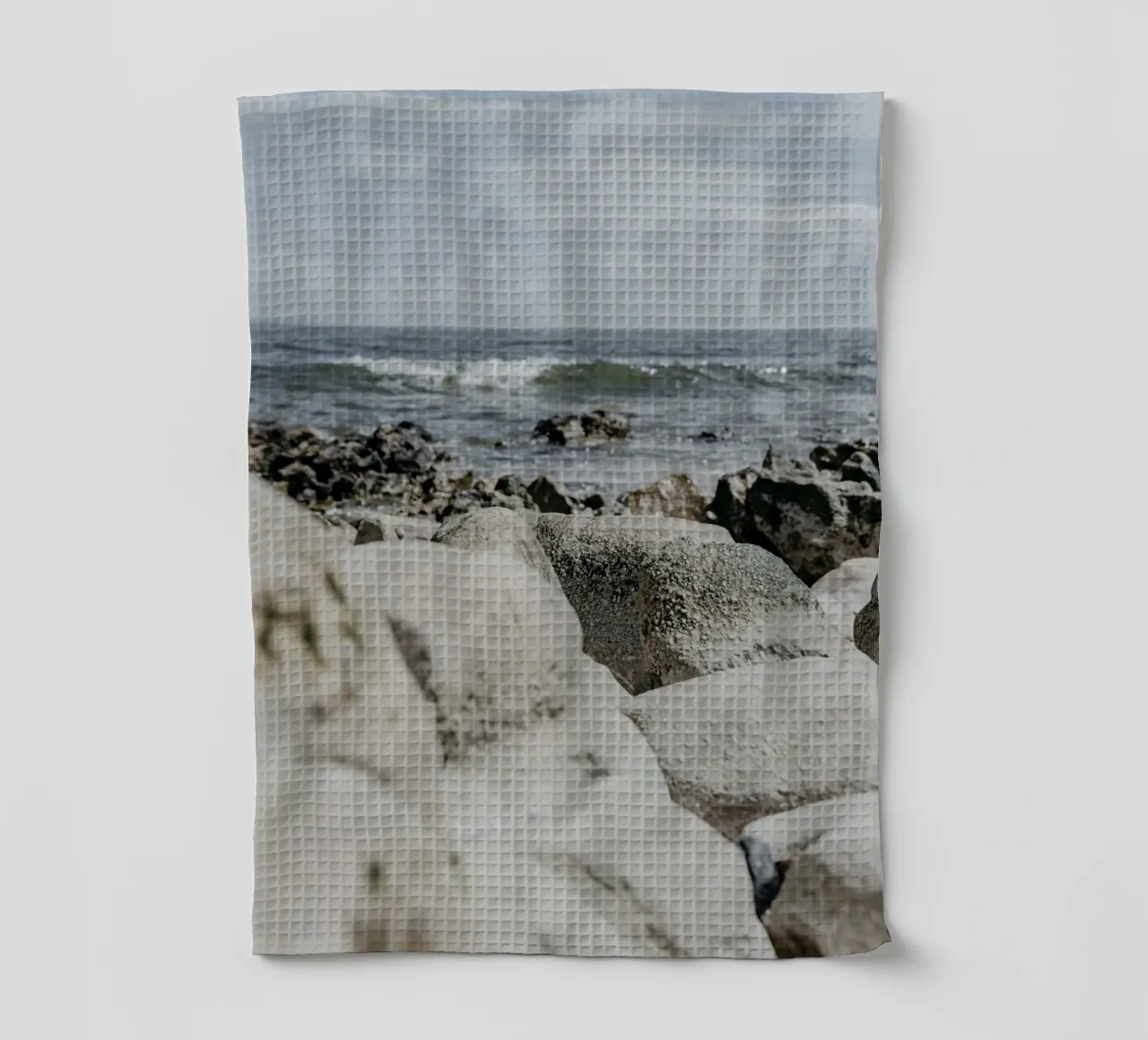 Waves and rock formations tea towel by Carinaprint