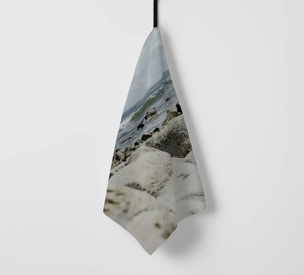 Waves and rock formations tea towel by Carinaprint