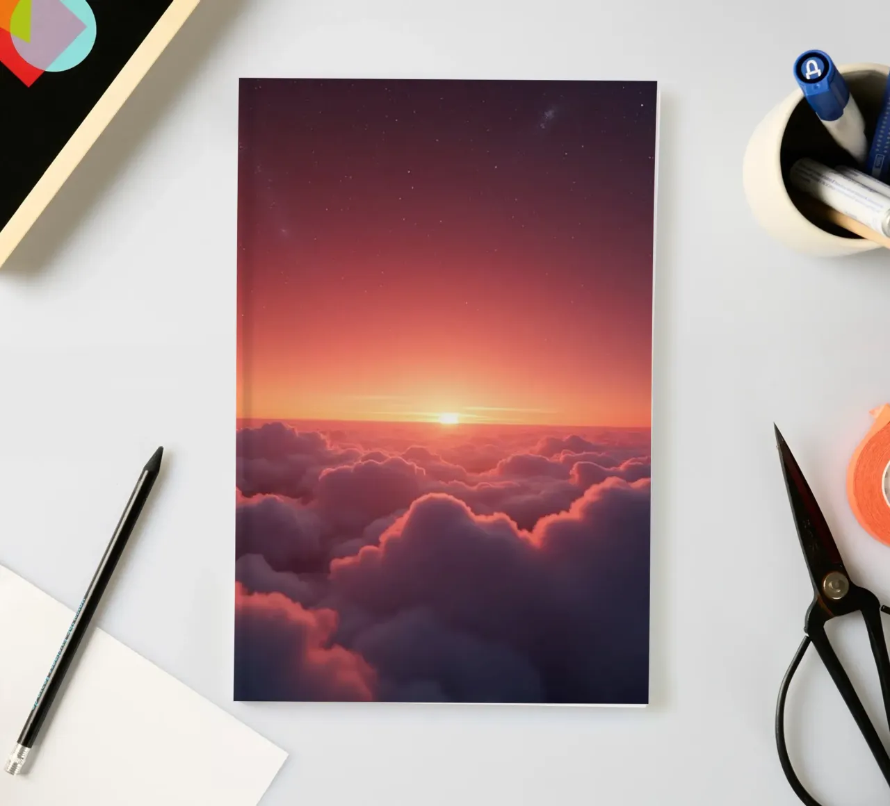 Vibrant sunset glowing above fluffy clouds in a serene sky notebook by DesignDoodle