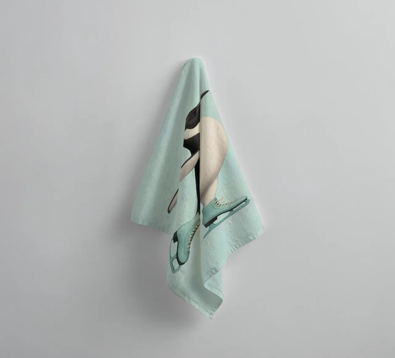 Penguin Dancing on Ice Skates – Winter Joy in Mint Green towel by Lootprint