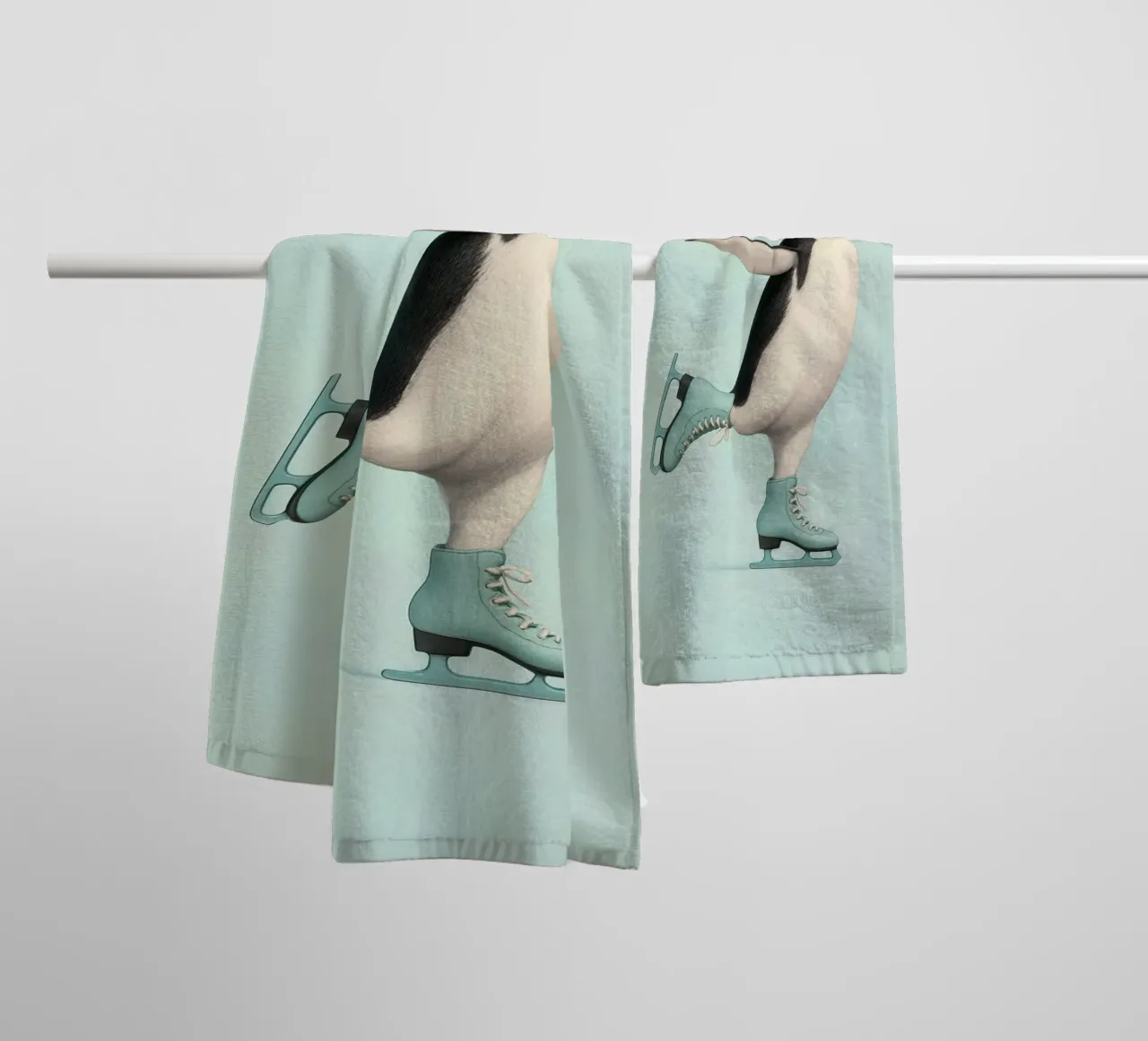 Penguin Dancing on Ice Skates – Winter Joy in Mint Green towel by Lootprint