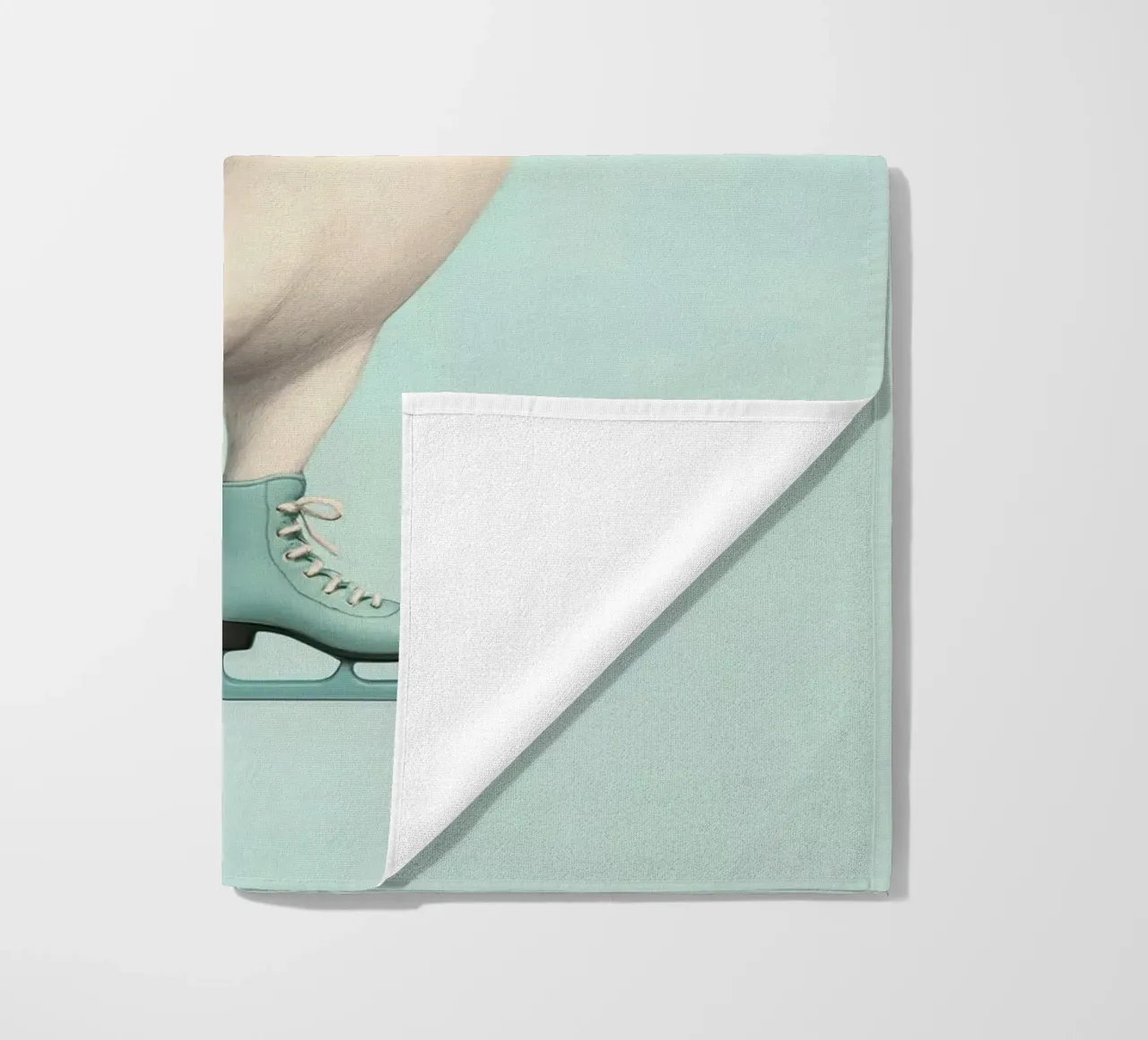 Penguin Dancing on Ice Skates – Winter Joy in Mint Green beach towel by Lootprint