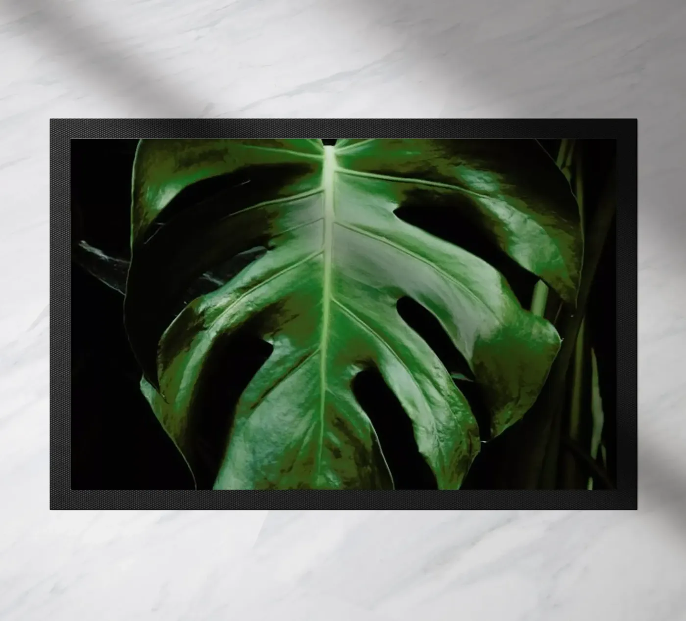 Monstera Leaf doormat by Ingrid Beddoes