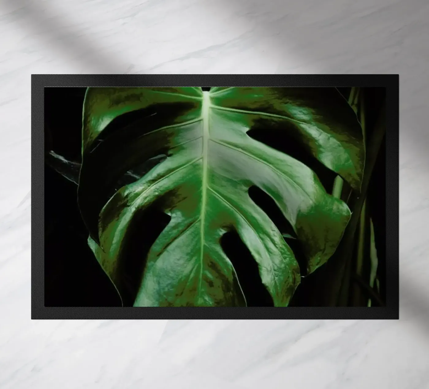 Monstera Leaf doormat by Ingrid Beddoes