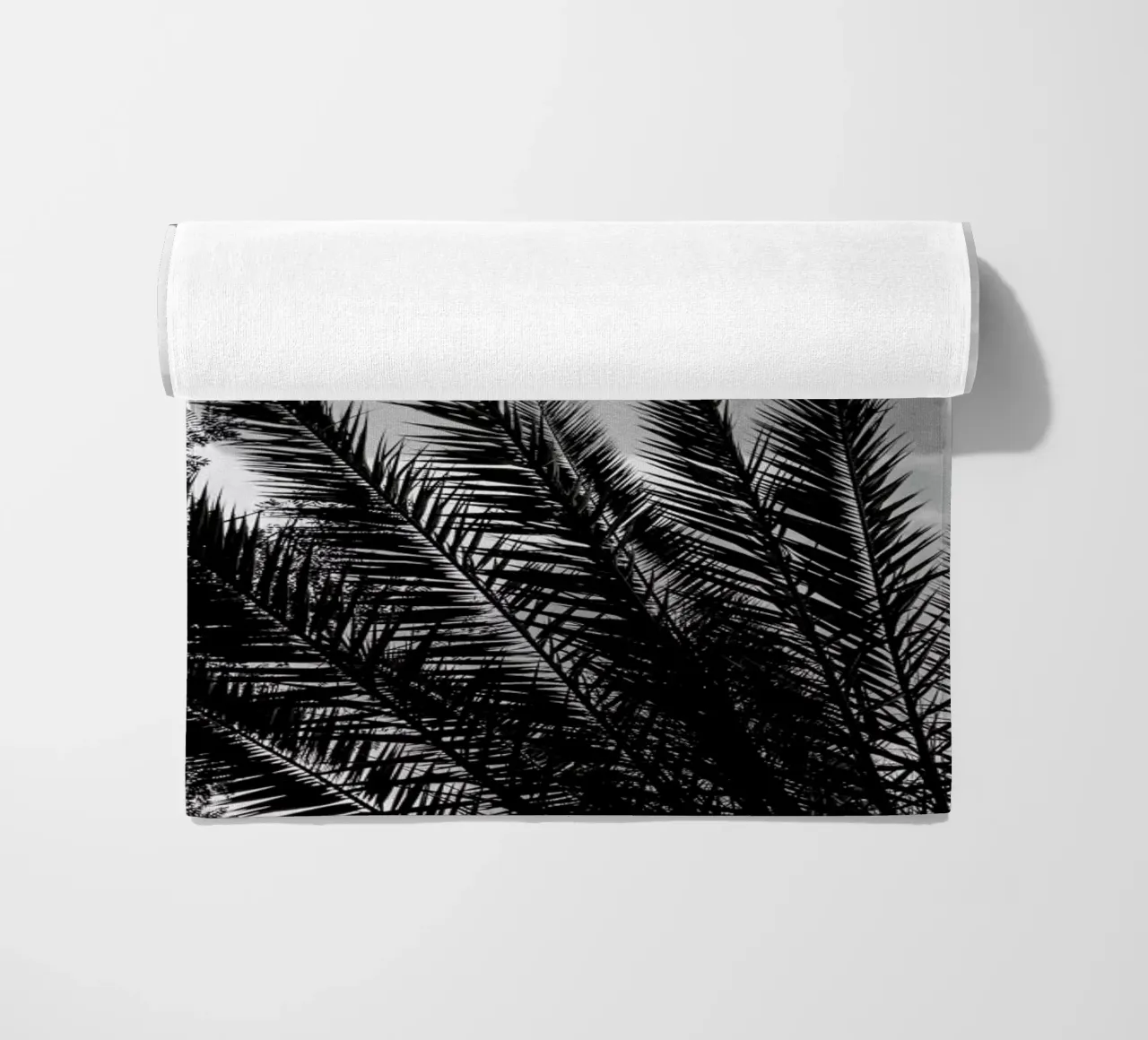 Palm Skies beach towel by Sebastian Hilgetag