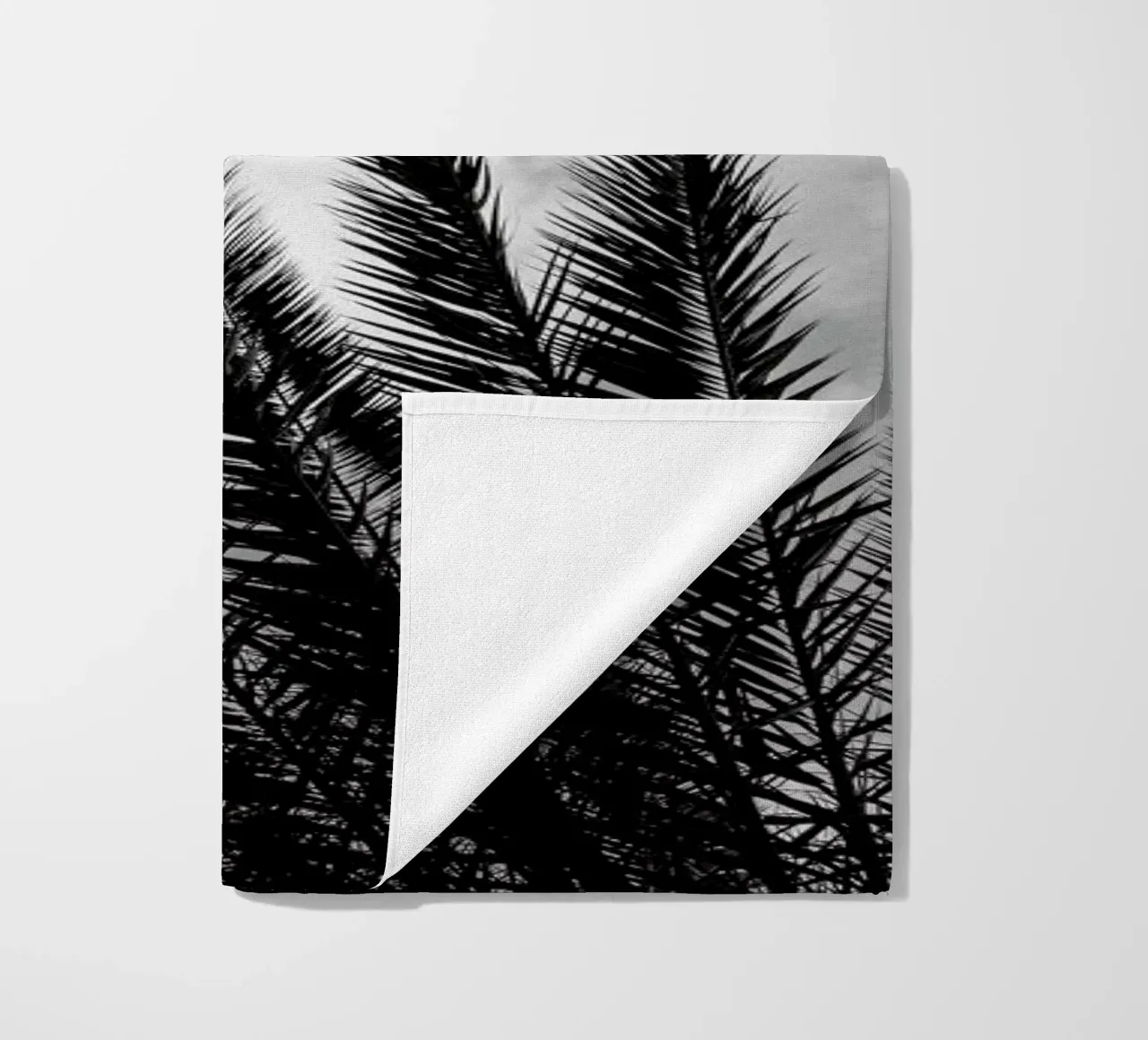 Palm Skies beach towel by Sebastian Hilgetag