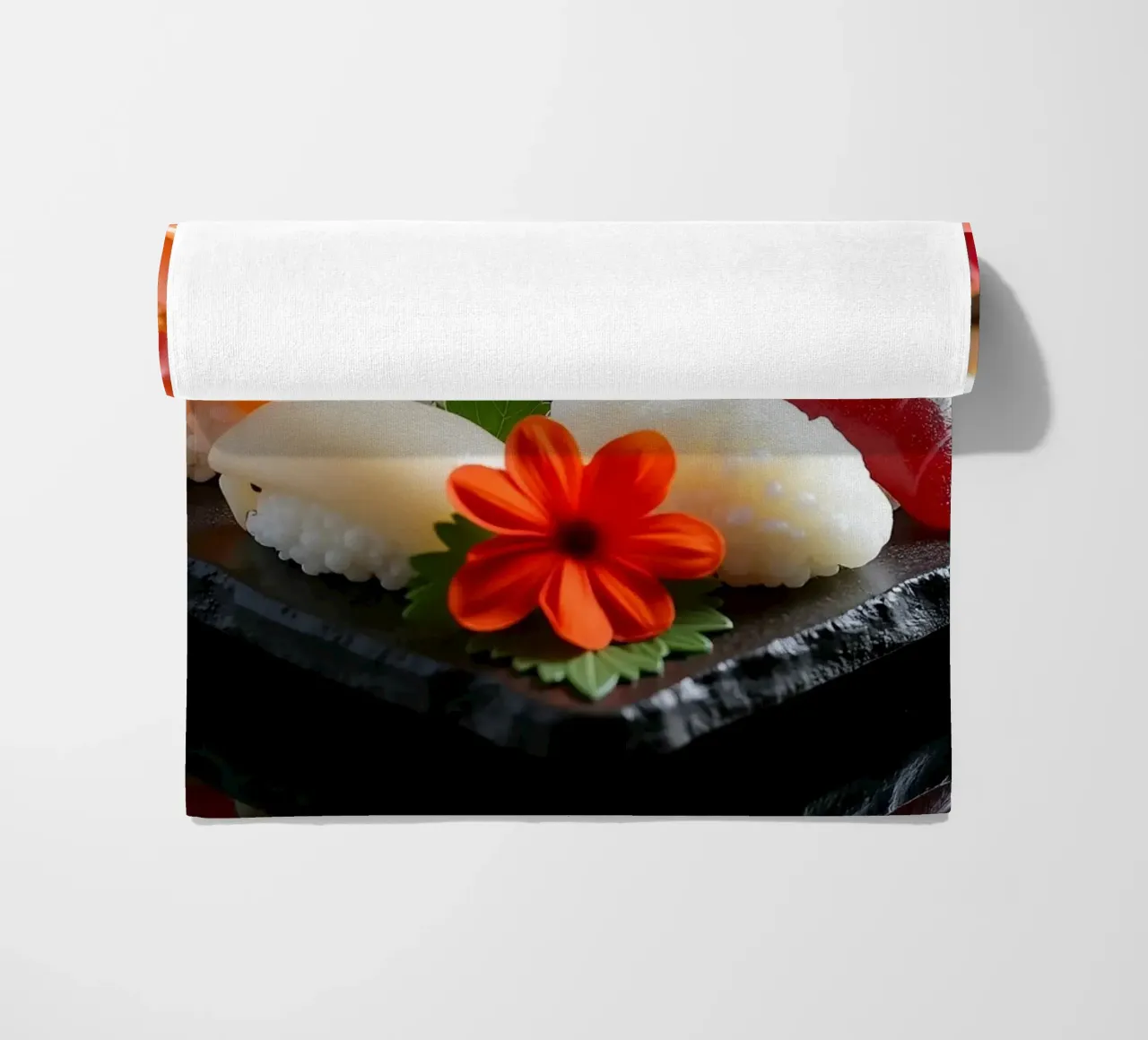Piatto di sushi colorato disposto a forma di cuore con fiori telo mare da DesignDoodle