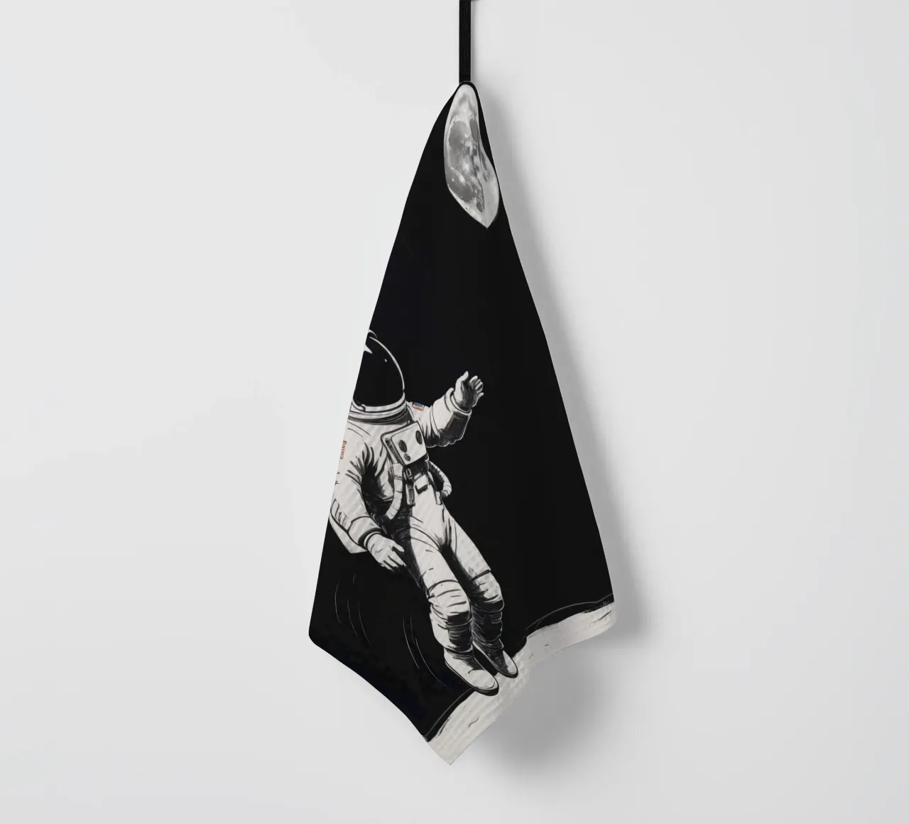 Astronaut exploring the moon's surface during a serene lunar tea towel by DesignDoodle