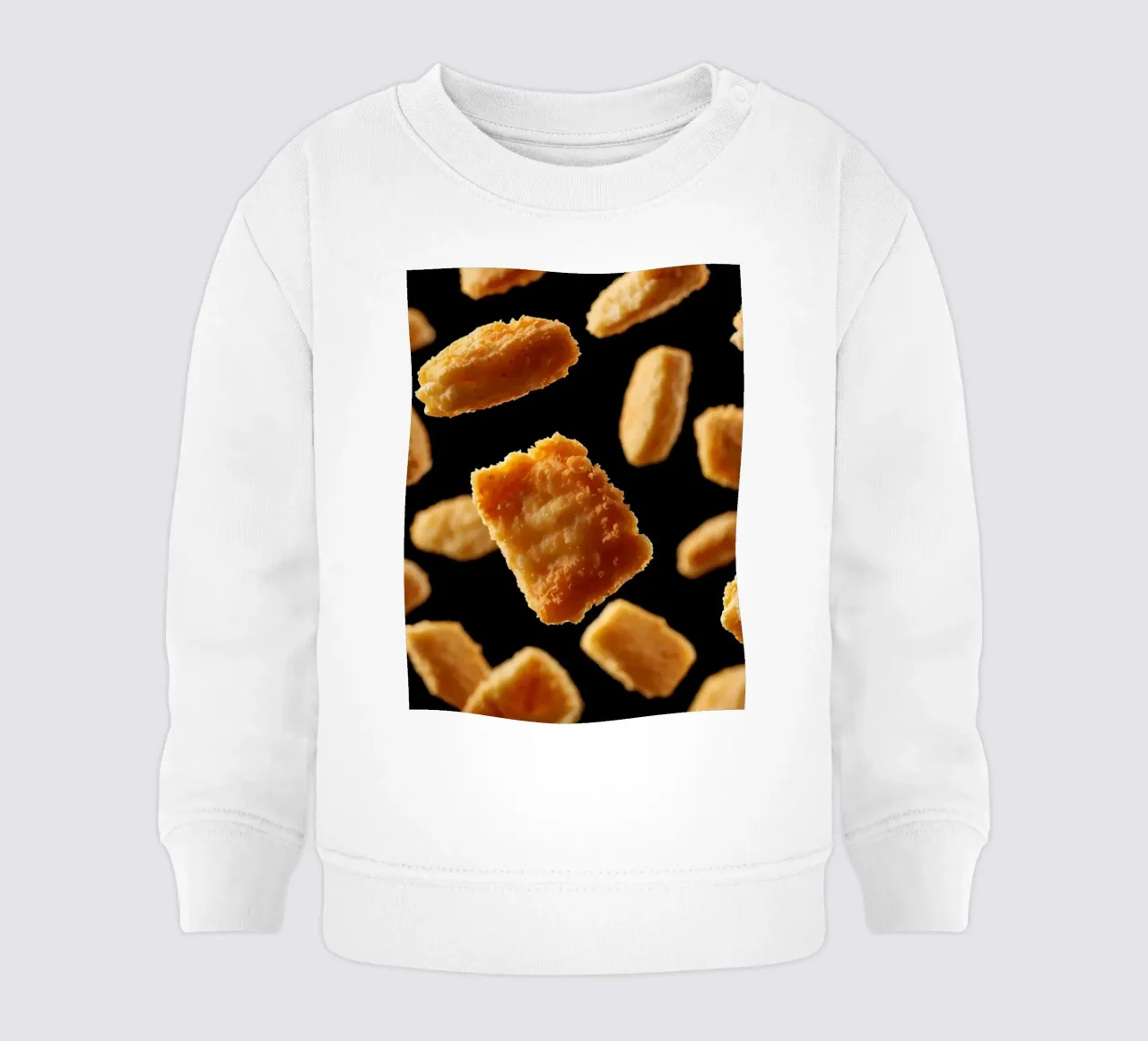 Nuggets in mid-air create a dynamic culinary display baby sweatshirt by DesignDoodle