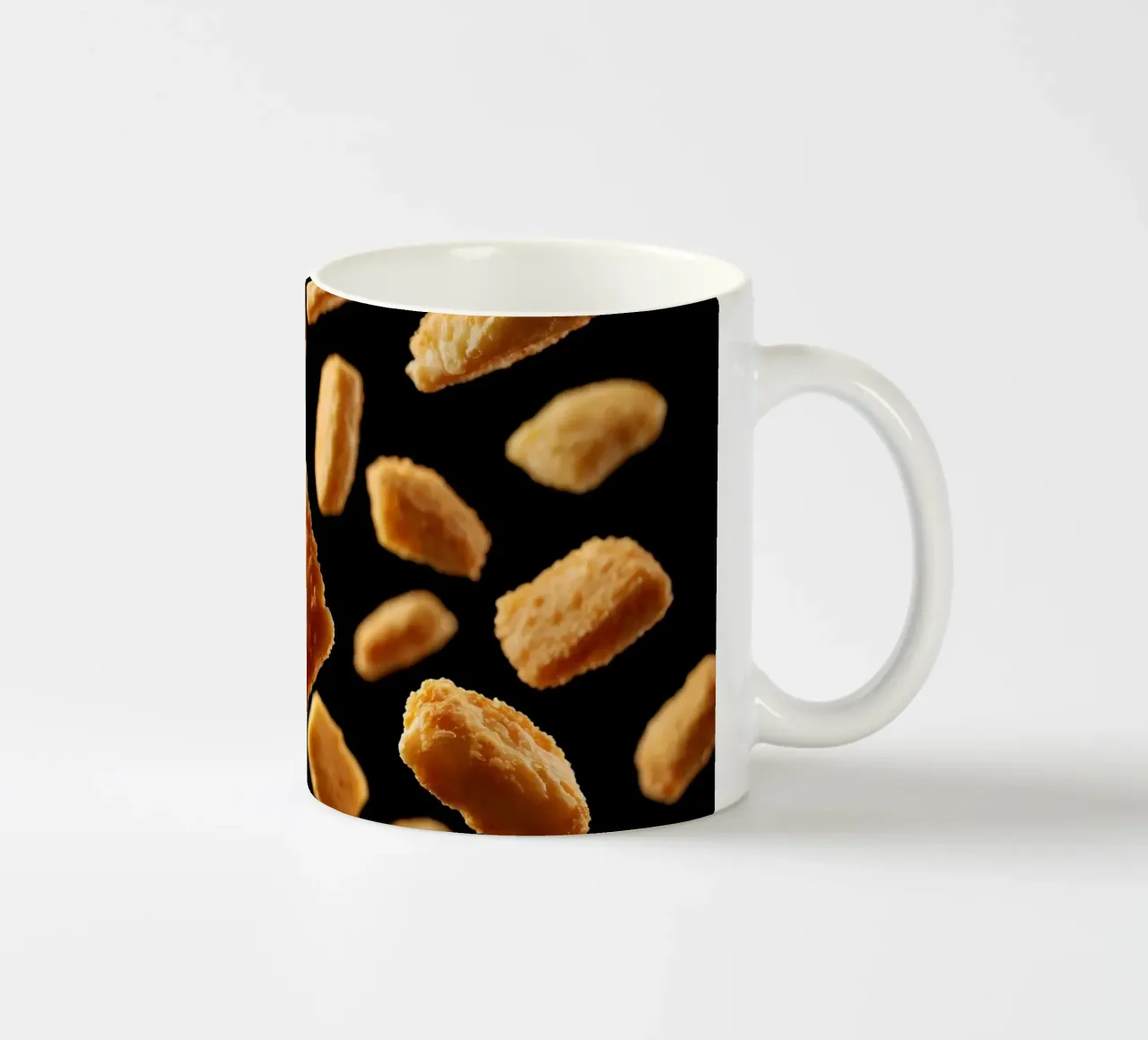Nuggets in mid-air create a dynamic culinary display ceramic mug by DesignDoodle