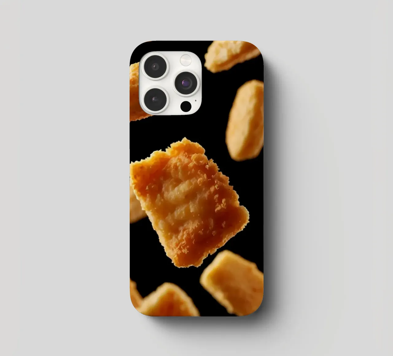 Nuggets in mid-air create a dynamic culinary display iphone case by DesignDoodle