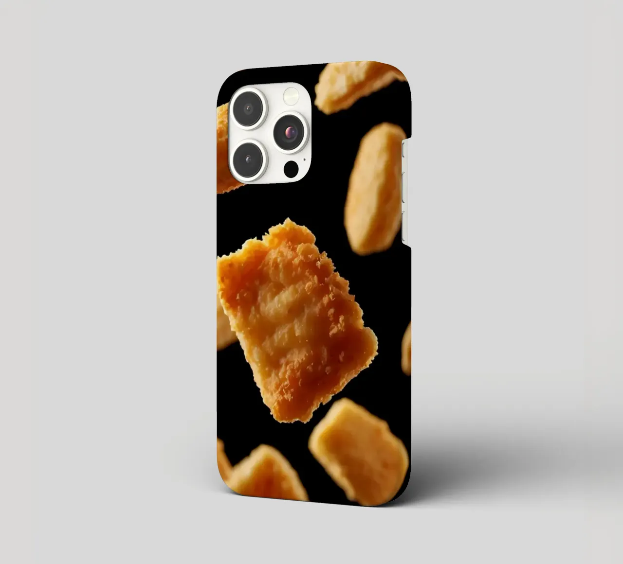 Nuggets in mid-air create a dynamic culinary display iphone case by DesignDoodle