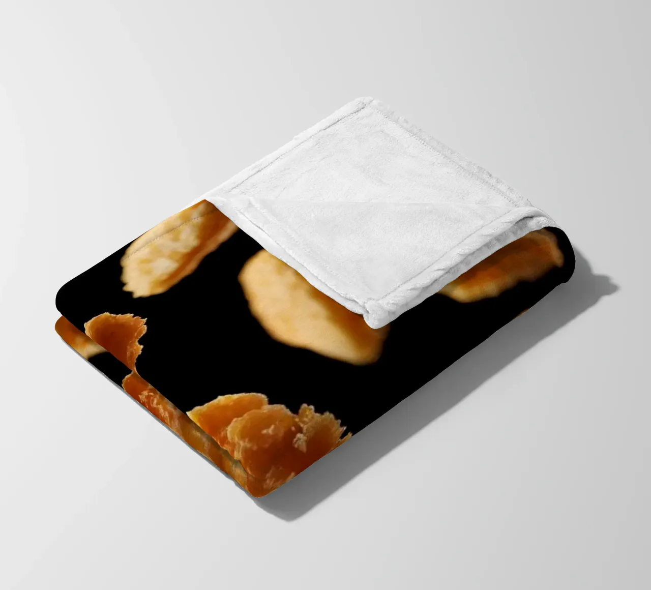 Nuggets in mid-air create a dynamic culinary display fleece blanket by DesignDoodle