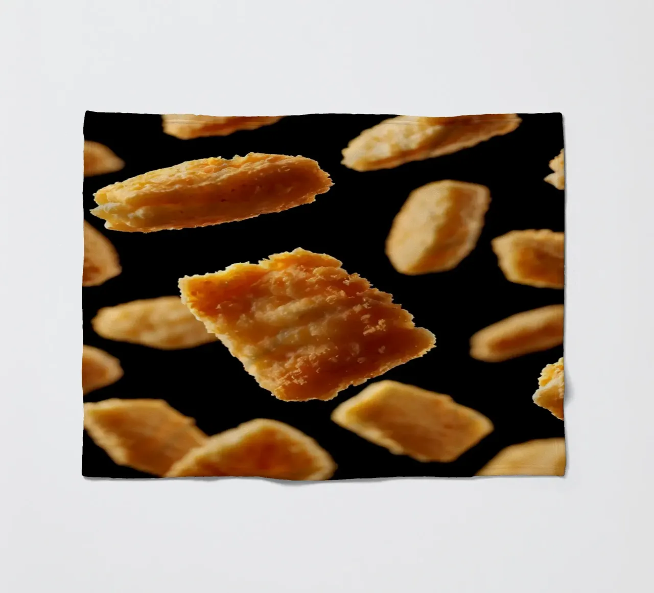 Nuggets in mid-air create a dynamic culinary display fleece blanket by DesignDoodle