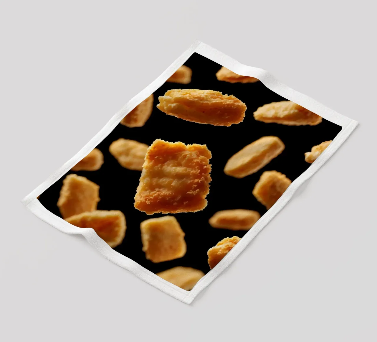 Nuggets in mid-air create a dynamic culinary display fleece blanket by DesignDoodle