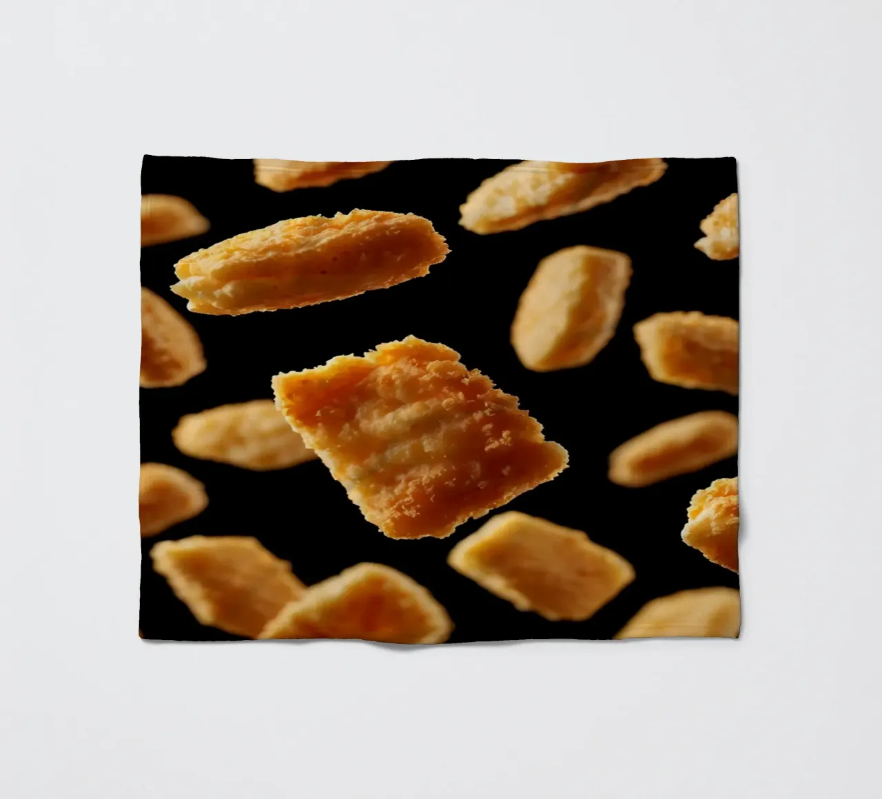 Nuggets in mid-air create a dynamic culinary display fleece blanket by DesignDoodle