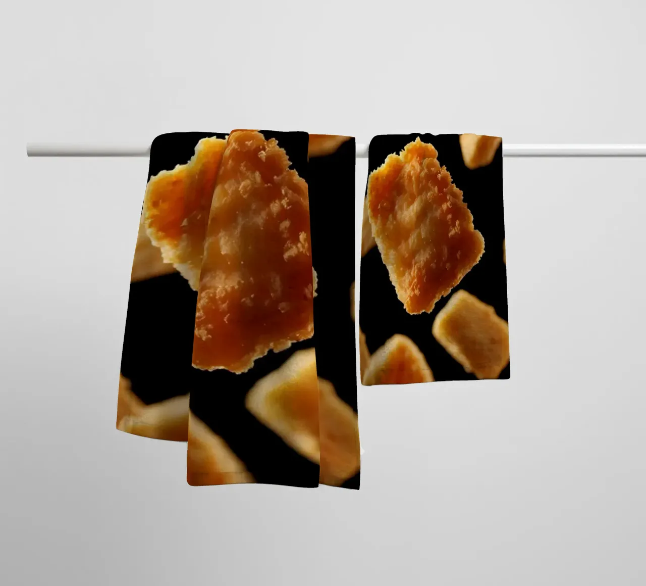 Nuggets in mid-air create a dynamic culinary display towel by DesignDoodle