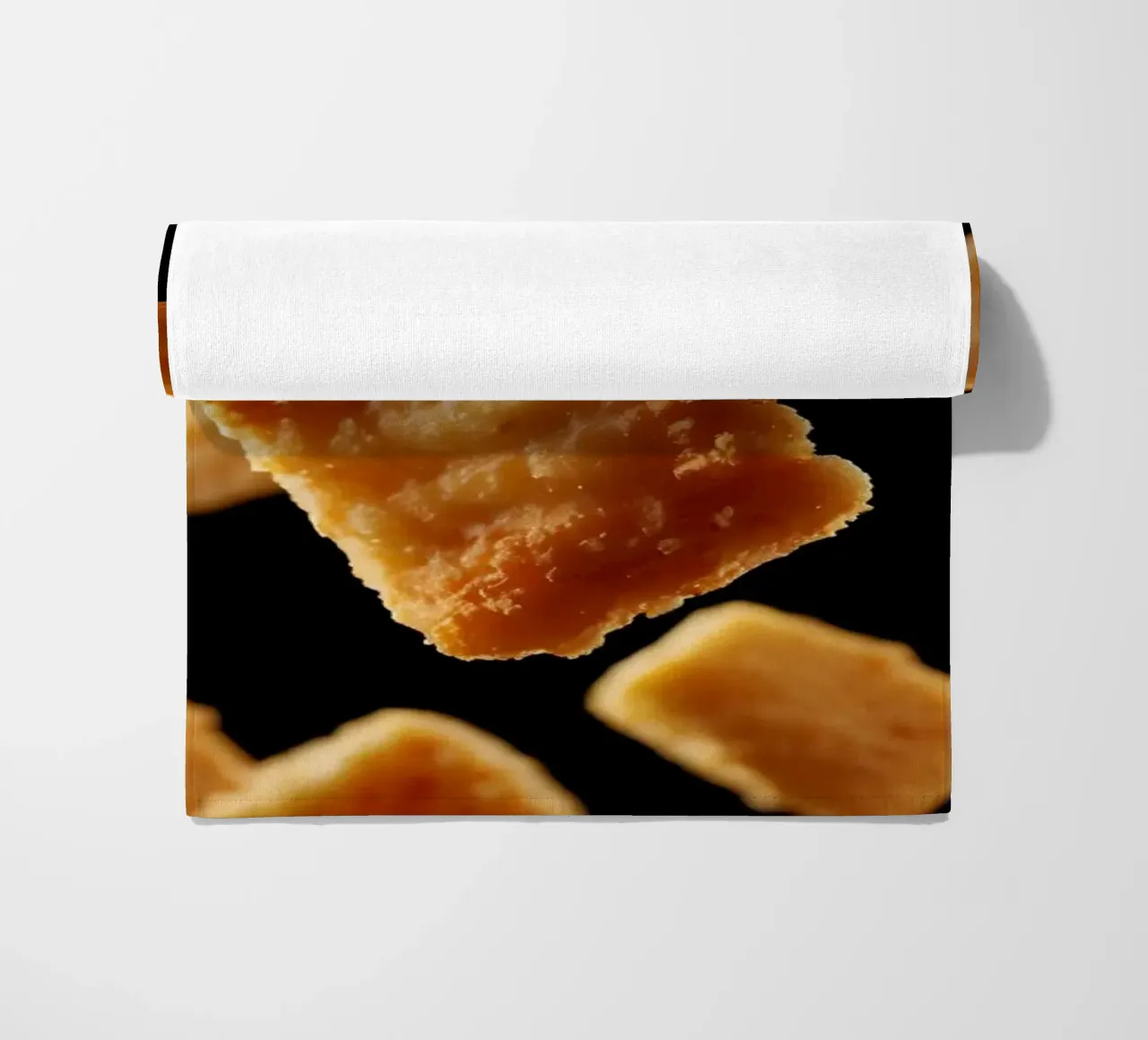 Nuggets in mid-air create a dynamic culinary display beach towel by DesignDoodle