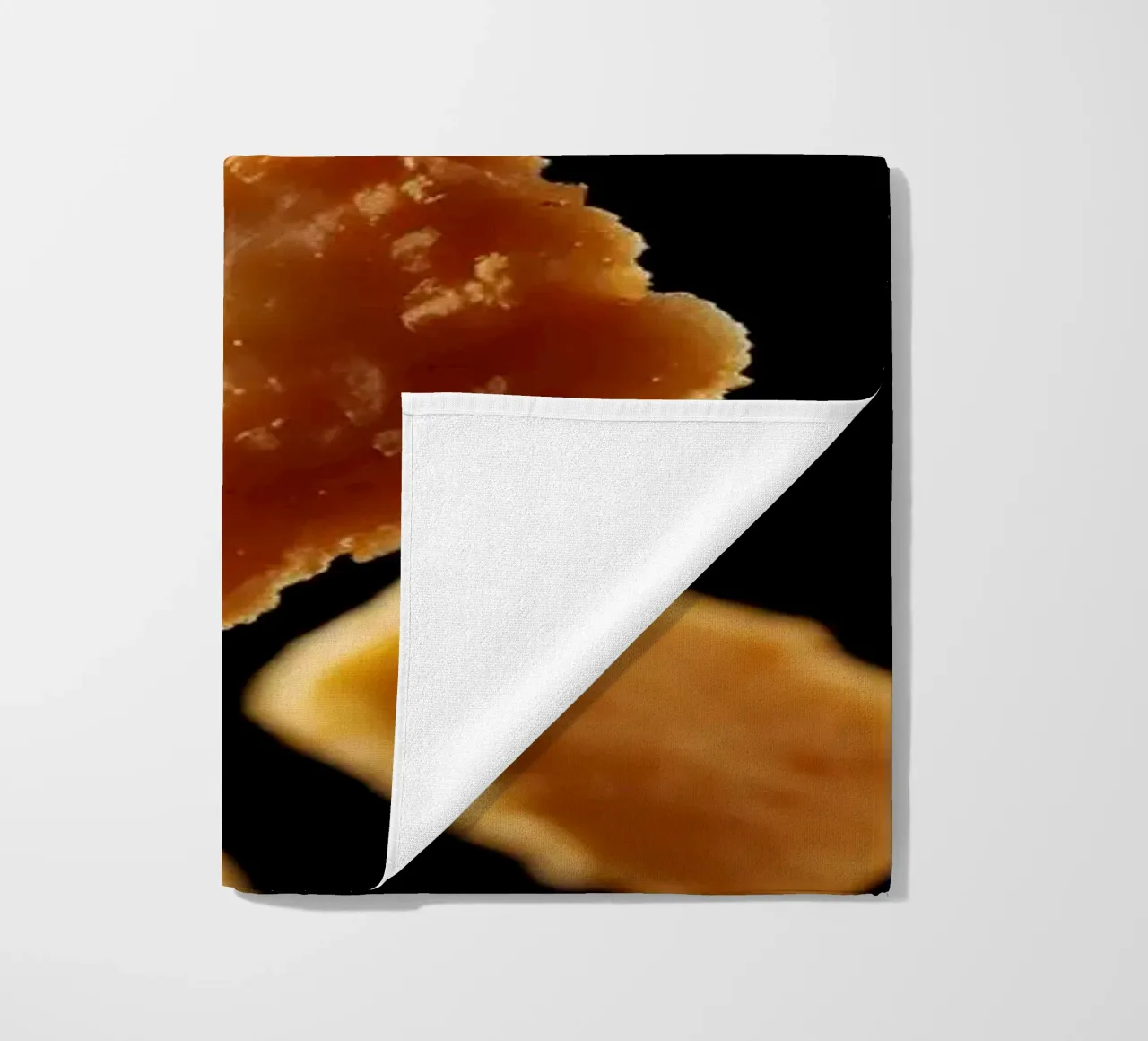 Nuggets in mid-air create a dynamic culinary display beach towel by DesignDoodle