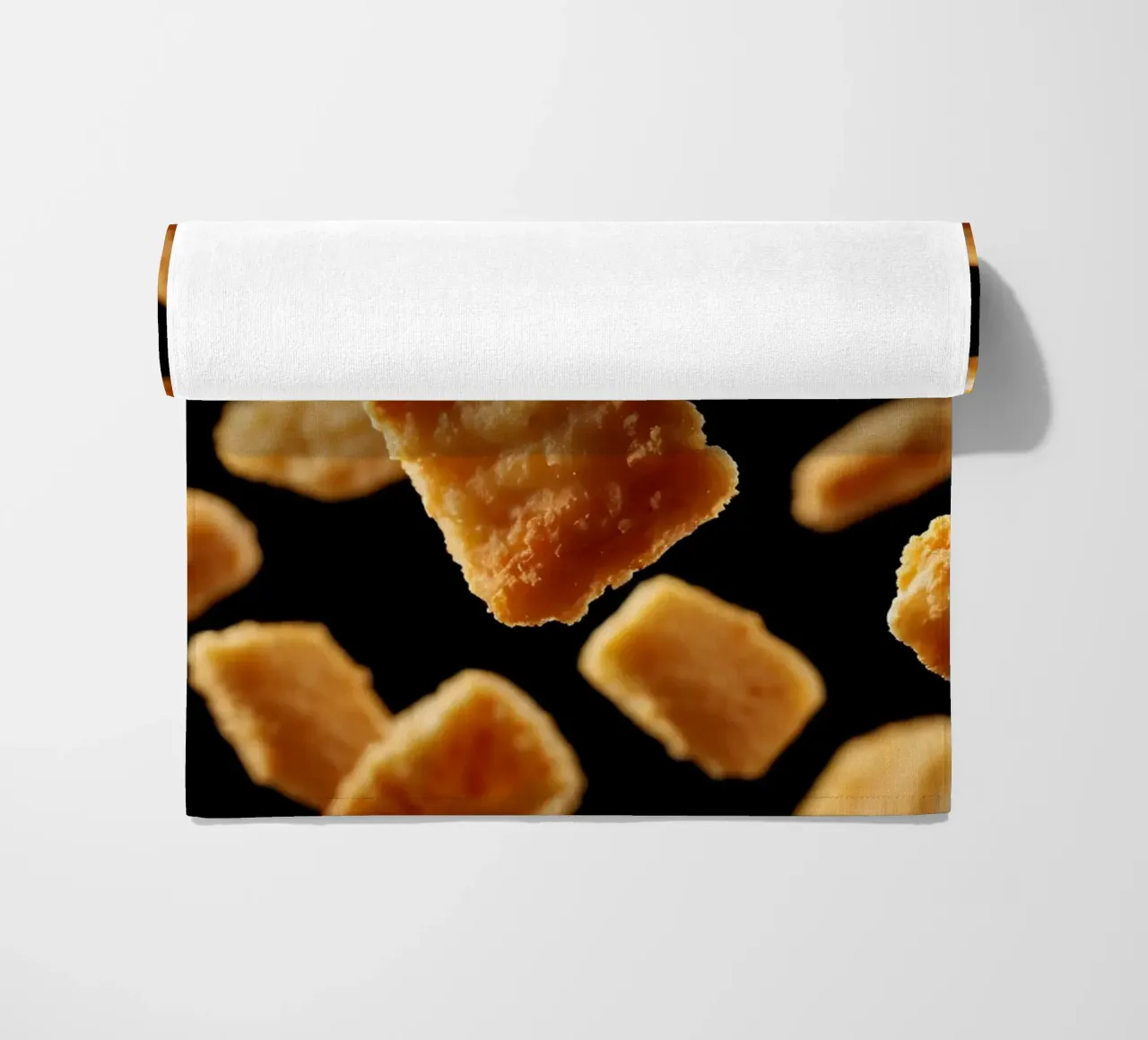 Nuggets in mid-air create a dynamic culinary display beach towel by DesignDoodle